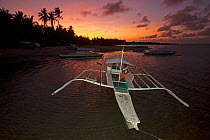 Bangka boat moored at sunrise, Jao Island, Danajon Bank, Central Visayas, Philippines, April 2013