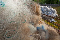Two tons of discarded plastic fishing nets ready to be shipped out and recyled in to carpet material, Jao Island, Danajon Bank, Central Visayas, Philippines, April 2013