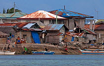 Houses and bangka boats, Bilang Bilangang Island, Danajon Bank, Central Visayas, Philippines, April 2013