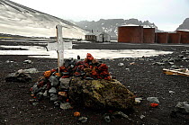 Grave covered with red rocks, near Old Whaling Station. Deception Island. Antarctica