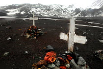 Graveyard with rubble covered graves, old whaling station. Deception Island, Antarctica.