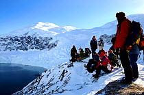 Tourists looking out across Neko Harbour, Andvord Bay. Antarctic Peninsula, Antarctica