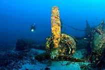 Scuba diver exploring the wreck of aeroplane 'B-24 Liberator'  Vis Island, Croatia, Adriatic Sea, Mediterranean