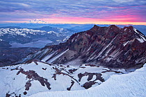 A sunrise view from the crater rim of Mount St Helens. Down below is Spirit Lake, and in the distance Mount Rainier. Washington, USA. May 2013