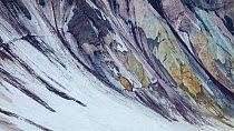 Colorful layers of rock on the inside of Mount St Helens' crater, seen from the rim. Washington, USA. May 2013