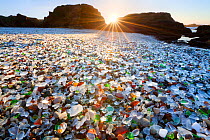 Glass beach at sunset - a former dump site, in which the glass has now become pebbles of sea glass.  MacKerricher State Park. California. USA. January 2013