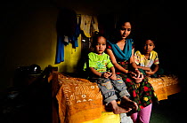 Rabina, widow, in the room that serves as a shelter with her two children, Subin and Sahan, in Namaskar Association House of Widows'. Culturally in Nepal women lose many rights when they become widow...