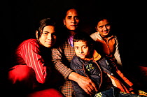 Sita, widow, with her children, Goma, Anish and Aarati,  in the room that serves as a home, in Namaskar Association House of Widows'. Culturally in Nepal women lose many rights when they become widow...