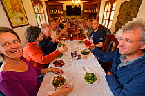 Dinner with the ARK Foundation team in Madzharovo at the Wild Farm, on the right Wouter Helmer, Rewilding Europe and ARK, Eastern Rhodope Mountains, Bulgaria, May 2013.