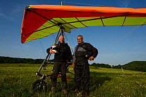Steffan Widstrand photographer with microlight pilot in front of microlight, Madzharovo, Eastern Rhodope Mountains, Bulgaria, May 2013.
