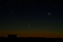 New moon and geminid meteor seen from Zagora, Morocco. December 2012