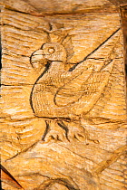 Wood carving of Uvea Parakeet (Eunymphicus uvaeensis) at Mouli Bridge, Ouvea, Loyalty Islands Province, New Caledonia.