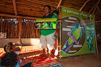 Anna Baouma from A.S.P.O. teaching children about conservation of New Caledonia, August 2012. Ouvea, Loyalty Islands Province, New Caledonia.