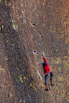 Man climbing the Screaming Yellow Zonkers route in Smith Rocks State Park, Oregon, May 2013. Model released.