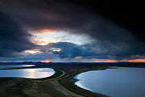View over the Campbell Lakes with stormy clouds at dusk, viewed from Walker Valley Overlook in Hart Mountain National Antelope Refuge, Oregon, USA, May 2013.