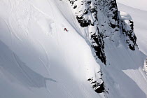 Snowboarder descending Table Mountain in the Heather Meadows Recreation Area, Washington, USA. March 2013.
