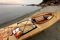 Fly fishing gear and kayak along the shore of the Strait of Juan de Fuca, Washington, USA, July 2013.