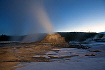 Sunrise at Castle Geyser in the Upper Geyser Basin, Yellowstone National Park, Wyoming, USA, February 2013.