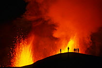 People watching the Fissure eruption of Chico volcano into 9km diameter caldera. Sierra Negra volcano, Isabela Island, Galapagos, Ecuador. October 2005.