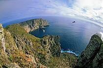Wenman Island (Wolf Island) fish eye view from summit  of Outpost Island, remnant of volcanic caldera, hosting large colonies of Red-footed boobies and Greater frigatebirds, also home to Vampire finch...