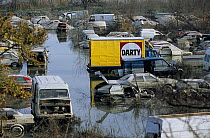 Flooded cars in scrapyard in Arles city flooded by the Rhone in December 2003. Camargue, France.