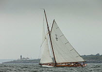 &#39;Spartan&#39;, a 72 foot Herreschoff, built in 1913, rounding Beavertail Light, during the Classic Yacht Regatta, Newport, Rhode Island, USA, August 2013. All non-editorial uses must be cleared in...