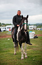 Traveller riding his horse at Appleby Horse Fair, Yorkshire, UK