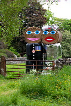 Straw bales dressed as Prince William and Kate Middleton to celebrate the royal wedding, Yorkshire, summer 2012.