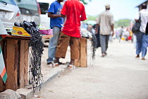 Streetside stalls selling mobile phone chargers, Darajani District, Zanzibar, Tanzania