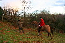 Huntsman chases a hunt saboteur, South Herefordshire, UK