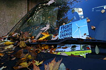 Fight Climate Change fly poster under windscreen wiper