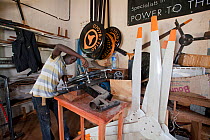 Wind power technician constructing a turbine, Kisumu Region, Kenya
