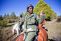 Wildlife poaching mounted patrol tracking and noting animal movement, Mount Kenya National Park, Kenya