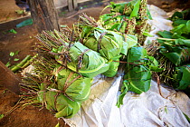Bundles of Khat (Catha edulis) wrapped in banana leaves awaiting packing and transport, Maua, Meru region, Kenya