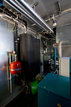 View inside a bank of electricity producing engines running on methane, part of a biogas plant, Spain, January, 2013.