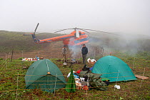 Helicopter and photographers campsite in Kamchatka, Far East Russia, July 2005.