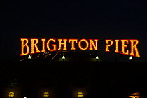 Brighton Pier, neon sign at night, Sussex, England, UK. October 2011.