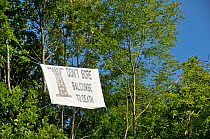 Anti-fracking protest, sign in tree, Balcombe, West Sussex, England. 19th August 2013.