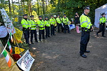 Anti-fracking protest, policemen guarding entrance to test drilling sight, Balcombe, West Sussex, England. 19th August 2013.