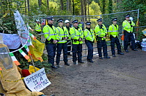 Anti-fracking protest, policemen guarding entrance to test drilling sight, Balcombe, West Sussex, England. 19th August 2013.