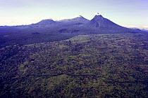 Virunga Massif Volcano Range (from left to right: Mount Visoke, Mount Karisimbi and Mount Mikeno) and adjoining forests, isolated and surrounded by human habitation and agriculture. Democratic Republi...