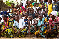 Men watching Zangbeto ceremony, Benin, Africa, February 2011.
