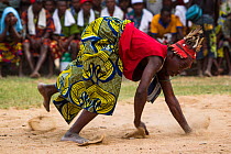 Man dancing during Zangbeto voodoo ceremony, Benin, Africa, February 2011.