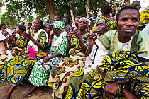 Group of people clapping during Zangbeto voodoo ceremony, Benin, Africa, February 2011.