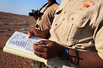 Save the Rhino Trust trackers monitoring Black rhino at Desert Rhino Camp, Wilderness Safaris, Kunene region, Namibia, May 2013