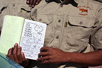 Save the Rhino Trust trackers recording data following rhino sighting in the Ugab river area, Save the Rhino Trust, Damaraland, Namibia, May 2013