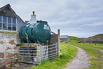 Unsecured diesel tank in isolated farmyard, Scotland, UK, May 2013.