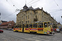 Tram and old brick arsenal building, UNESCO World Heritage Site,  Lviv, Ukraine, July 2013.