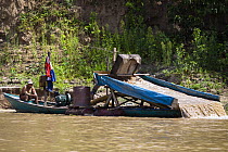 Boat gold panning at Rio Madre de Dios, Amazon Basin, Peru, South America, November 2011.