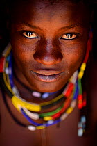 Portrait of Ovahakaona woman with colourful jewellry, Kaokoland, Namibia, September 2013.